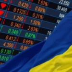 Ukrainian flag against the background of stock quotes